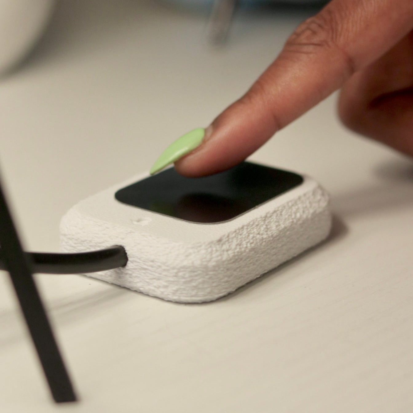 Person touching the Tactile switch to control the lamp