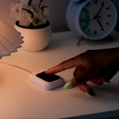 Finger touching the Tactile switch to control the lamp
