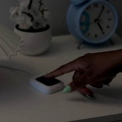 Hand touching the Tactile switch to control the lamp